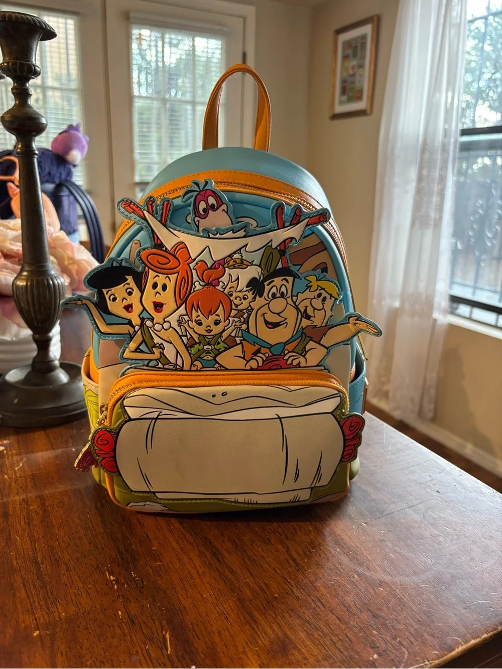 Cartoon Flintstones Loungefly Mini Backpack in Light Blue and Yellow